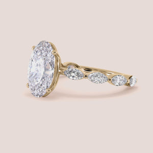 Elegant 14K or 18K gold engagement ring with East-West oval diamond and marquise side stones, perfect for special occasions.