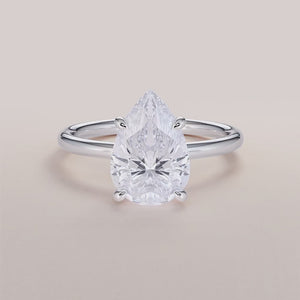 "Elegant Ophelia pear classic solitaire engagement ring in 14K white gold, showcasing timeless beauty and exquisite craftsmanship.