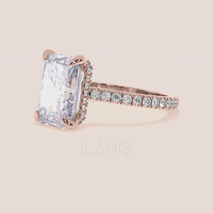 Radiant cut diamond engagement ring in rose gold with pavé band worn on hand, highlighting soft blush tones, brilliance and refined elegance 