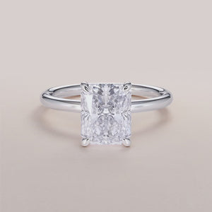 "Radiant classic solitaire engagement ring in 14K white gold, featuring a stunning design perfect for eternal love.