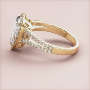 "14K yellow gold pear halo engagement ring with split shank and pave band, exquisite design for timeless elegance.