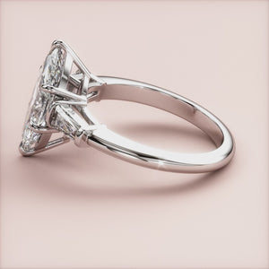 "Elegant 14K white gold marquise three-stone tapered baguette engagement ring, perfect for timeless romantic moments.