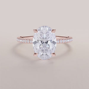 Rose gold 14K engagement ring with an oval diamond, invisible gallery, hidden halo, and pave band a stunning choice for love.