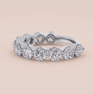 Elegant 14K or 18K white gold wedding band featuring a stunning row of round brilliant-cut diamonds, perfect for engagements. 
