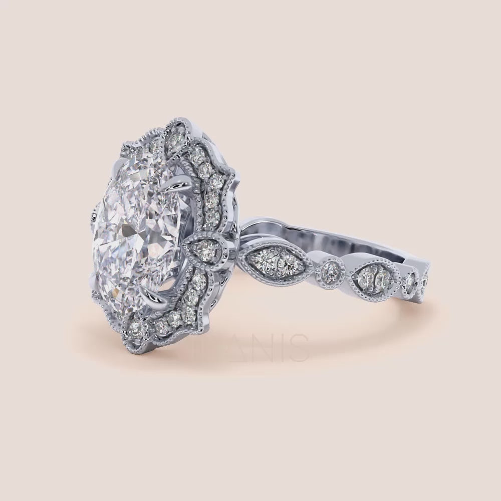 Detailed video viewing of oval halo vintage-inspired diamond ring set with exquisite filigree in recycled rose gold | #14KRecycledWhiteGold #18KRecycledWhiteGold #Platinum