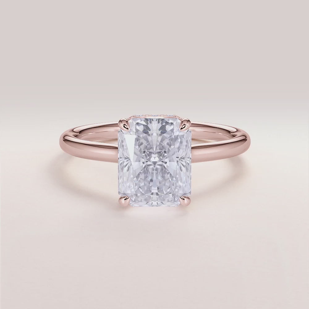 14K Rose Gold Jupiter Radiant Engagement Ring with Invisible Gallery and Hidden Halo, Elegant Plain Band Design.

#14KRecycledRoseGold
#18KRecycledRoseGold


"

