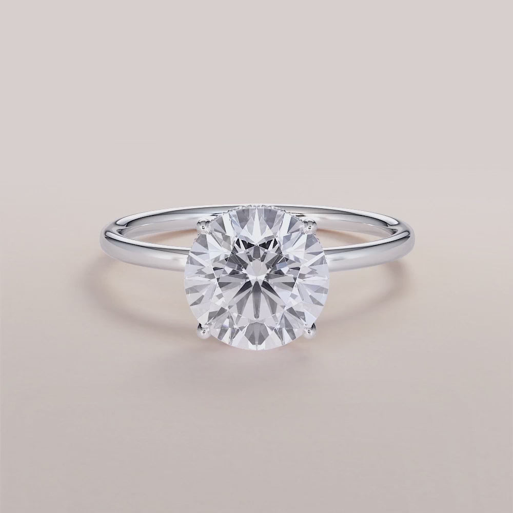"Elegant 14K white gold Saros round-wrapped hidden halo engagement ring with a sleek plain band, perfect for timeless romance.|

#14KRecycledWhiteGold
#18KRecycledWhiteGold








#Platinum"
