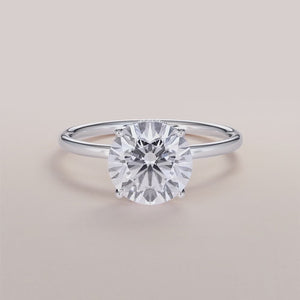 "Elegant 14K white gold Saros round-wrapped hidden halo engagement ring with a sleek plain band, perfect for timeless romance.