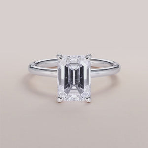 "14K white gold Elodie emerald classic solitaire engagement ring, showcasing timeless elegance and stunning craftsmanship.