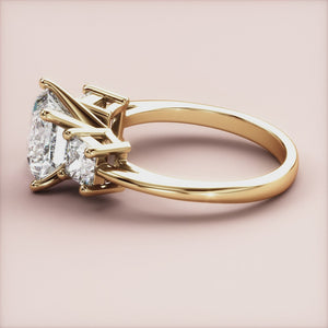 "14K yellow gold engagement ring featuring a princess three-stone design, blending elegance and modern style for a timeless look.