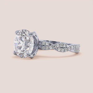 Radiant cut diamond engagement ring in 14K or 18K white gold or platinum with Pave diamond band, front view.