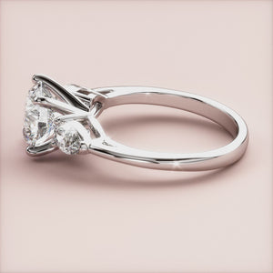"Elegant 14K white gold three-stone pear engagement ring, showcasing timeless beauty and sophistication for proposals.