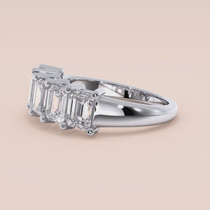 Elegant five-stone wedding band featuring emerald-cut diamonds in 14K or 18K gold or platinum.  Perfect for any special occasion.