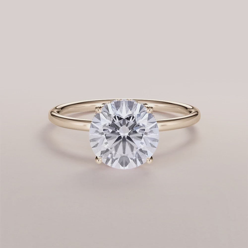 Elegant 14K yellow gold wrapped halo engagement ring with a marquise diamond centerpiece and small diamond accents.|




#14KRecycledYellowGold
#18KRecycledYellowGold





