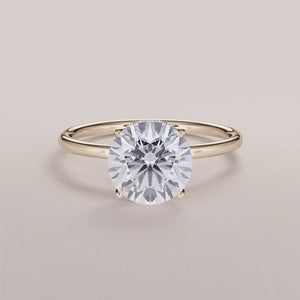 Elegant 14K yellow gold wrapped halo engagement ring with a marquise diamond centerpiece and small diamond accents.