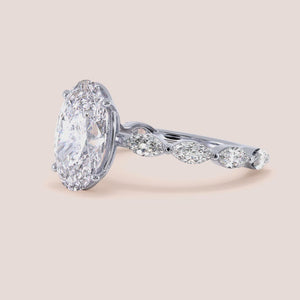 Elegant 14K/18K gold engagement ring with marquise-cut diamond and round diamonds, perfect for a timeless proposal.