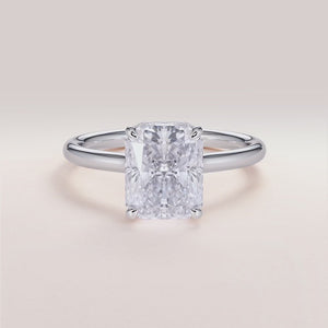 Elegant 14K white gold Jupiter radiant engagement ring featuring an invisible gallery, hidden halo, and plain band design.

#14KRecycledWhiteGold
#18KRecycledWhiteGold



#Platinum
