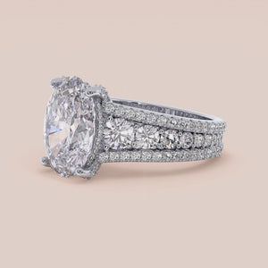 14K white gold Hanie engagement ring with oval hidden halo accents and a three-row band, perfect for elegant proposals.
