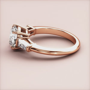 "Rose Gold 14K engagement ring featuring tapered baguette and round three-stone design, perfect for timeless elegance.