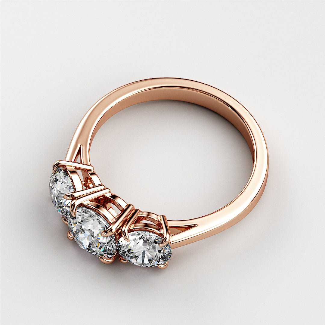 Elegant 14K rose gold wedding band featuring three round diamonds in a classic prong setting, perfect for engagements.