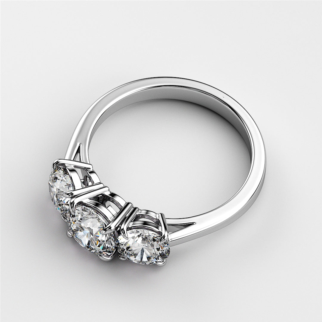 Elegant three-stone wedding band featuring round diamonds in a polished 14K or 18K white gold band. A timeless choice for commitment.