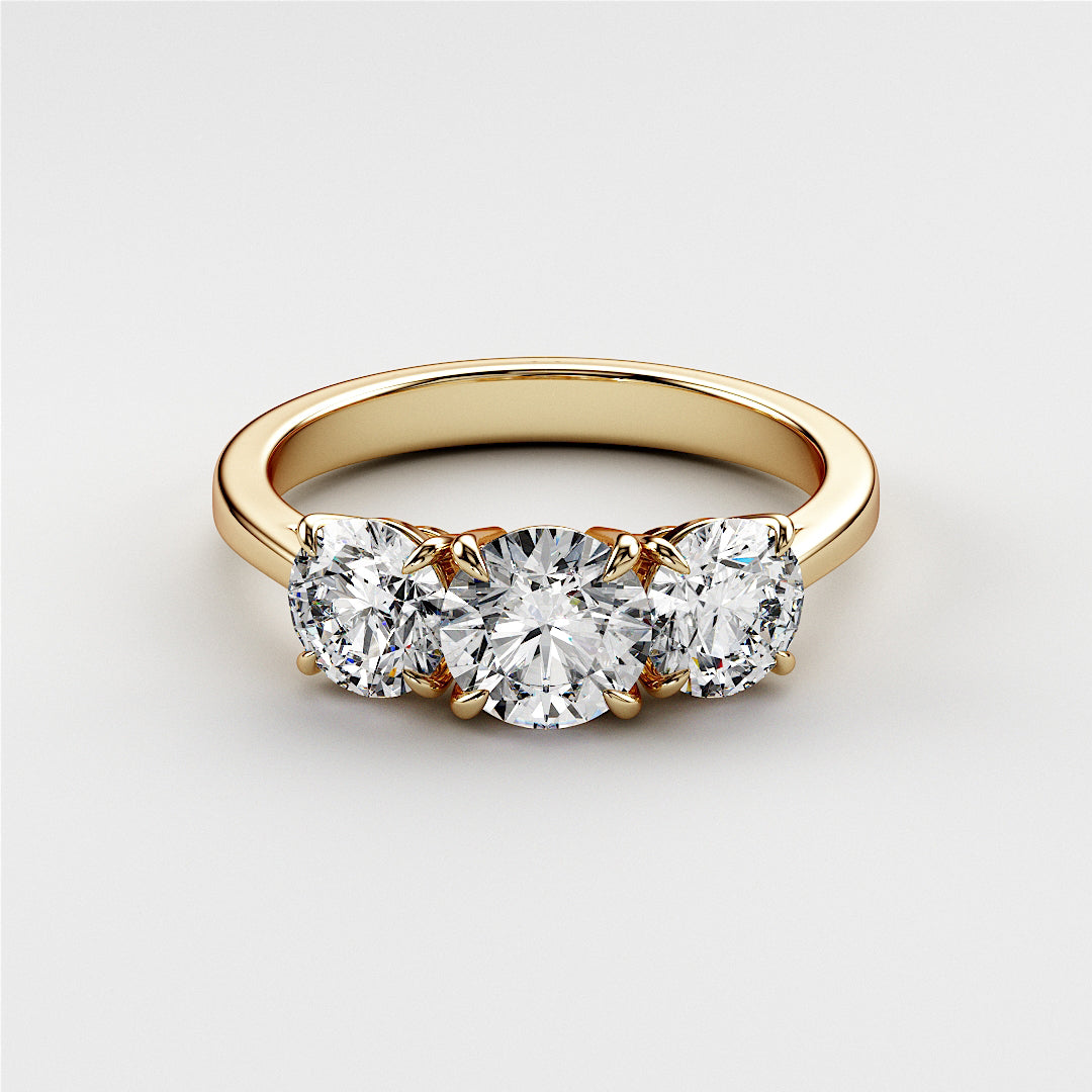 Elegant yellow gold three-stone wedding band featuring a stunning 0.70ct center, perfect for your timeless love story.