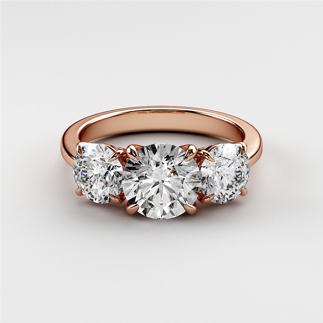 Elegant rose gold wedding band featuring three round diamonds, available in 14K, 18K, or platinum for timeless sparkle. 