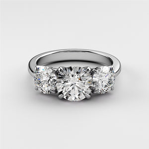Elegant three-stone round diamond wedding band in 14K or 18K gold or platinum, featuring dazzling brilliant-cut diamonds. 