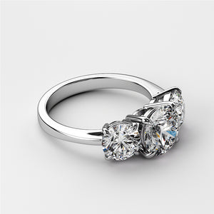 Elegant three-stone wedding band in 14K/18K gold or platinum, featuring round brilliant diamonds in a timeless design. 