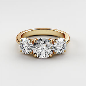 Elegant wedding band in 14K or 18K yellow gold featuring a three-stone design with sparkling round diamonds. 