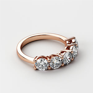 Elegant 14K rose gold wedding band featuring five round brilliant-cut diamonds in classic prong setting. Perfect for an eternity ring. 
