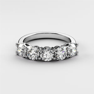 Elegant platinum or 14K/18K white gold wedding band featuring a row of dazzling marquise-cut diamonds. 