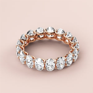 Elegant 14K/18K rose gold oval eternity wedding band, featuring brilliant cut diamonds and timeless design for radiant sparkle. 