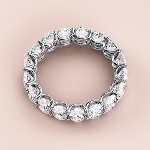 Stunning 14K or 18K white gold diamond eternity wedding band features round-cut diamonds for a dazzling effect. 
