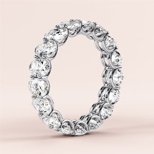 Elegant 14K or 18K gold eternity band with round-cut diamonds, perfect for weddings and special occasions. 