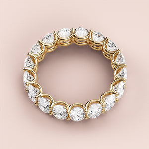 Elegant yellow gold wedding band featuring round brilliant-cut diamonds, available in 14K, 18K, or platinum. Perfect for eternity. 