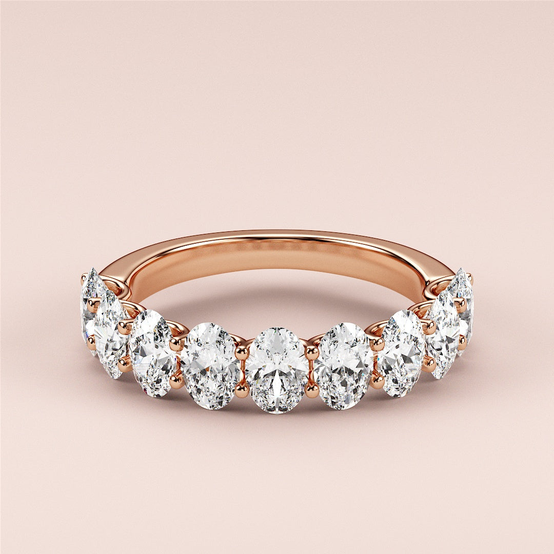 Elegant 14K or 18K rose gold wedding band featuring round brilliant-cut diamonds in a shared prong setting. |
 
 
 
 
 #14KRecycledRoseGold
 #18KRecycledRoseGold