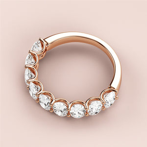 Elegant 14K Rose Gold half eternity wedding band featuring pear-shaped diamonds, perfect for special occasions and timeless elegance. 