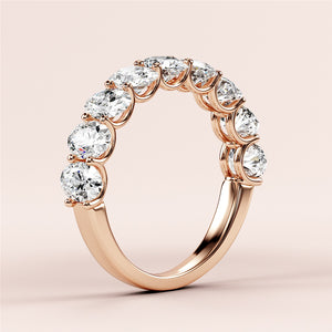 Elegant 14K or 18K rose gold wedding band featuring oval diamonds in a classic half eternity design. Perfect for everlasting love. 