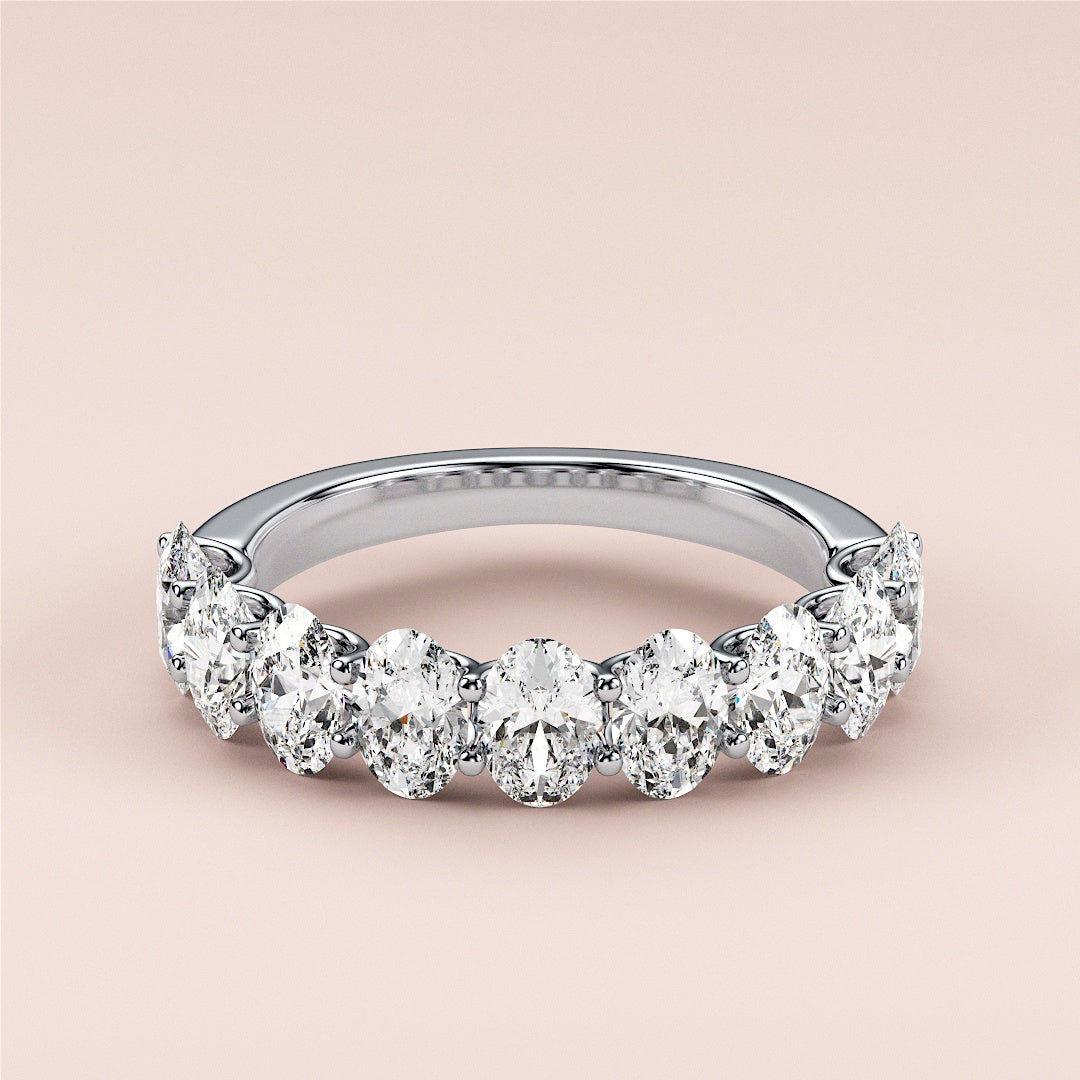 Elegant 14K, 18K, or platinum oval half eternity wedding band featuring pear-shaped diamonds against a neutral background. |
 #14KRecycledWhiteGold
 #18KRecycledWhiteGold
 
 
 
 
 #Platinum