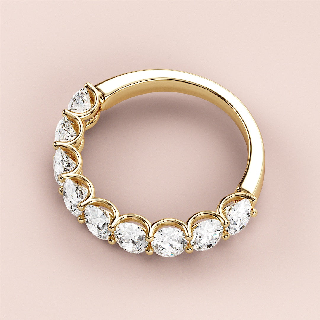 Elegant yellow gold wedding band featuring seven oval-cut diamonds, available in 14K, 18K, or platinum settings. |
 
 
 #14KRecycledYellowGold
 #18KRecycledYellowGold