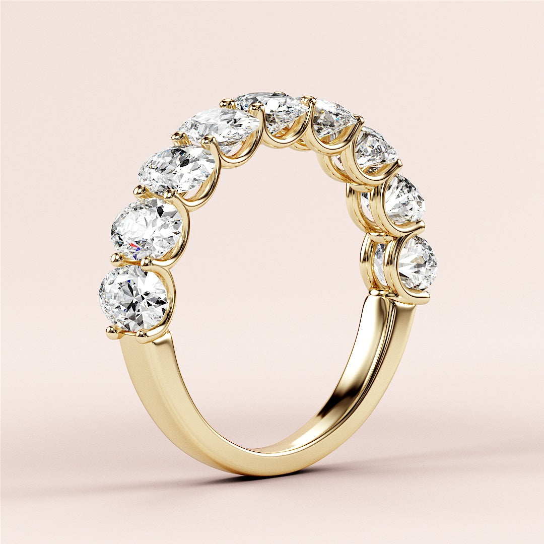 Elegant 14K or 18K yellow gold oval half eternity wedding band with round brilliant cut diamonds on a soft pink background. |
 
 
 #14KRecycledYellowGold
 #18KRecycledYellowGold