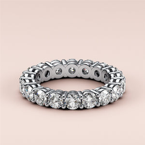 Elegant 14K or 18K gold or platinum wedding band featuring a continuous circle of diamonds, perfect for eternity and daily wear. 