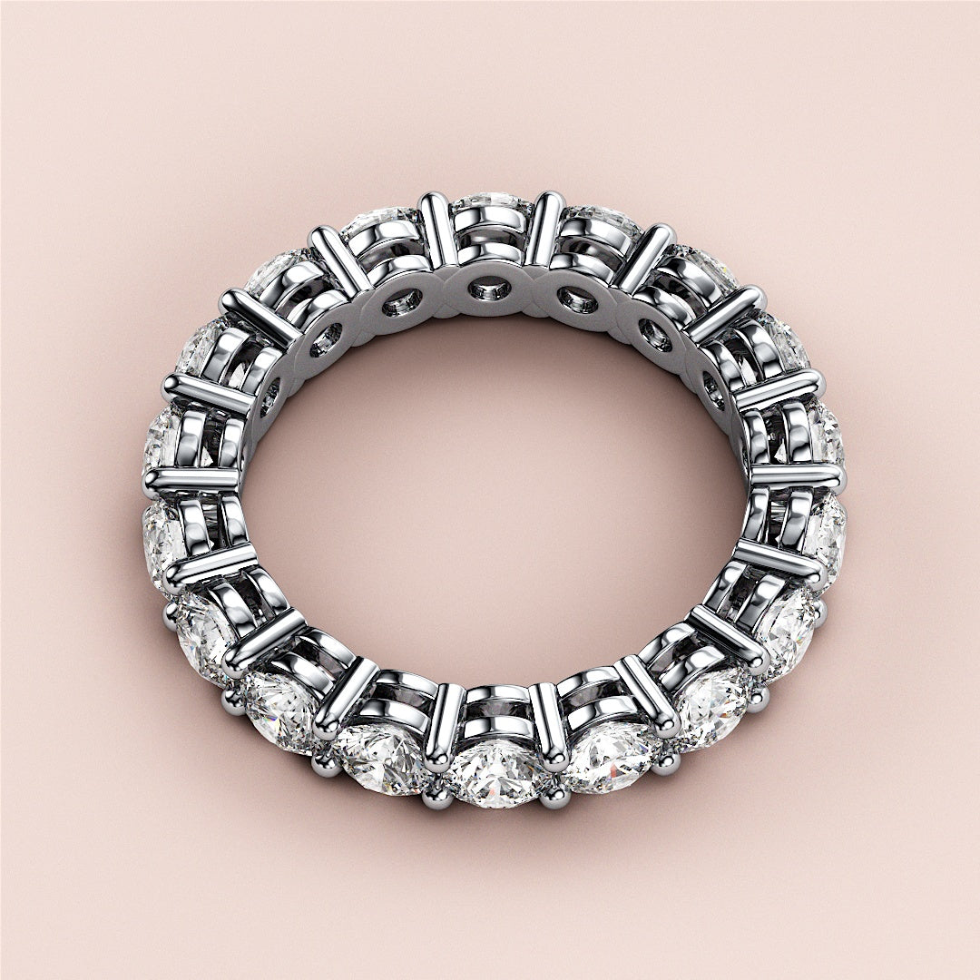 White gold eternity wedding band featuring sparkling diamonds, available in 14K, 18K, or platinum for timeless elegance. 