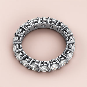 White gold eternity wedding band featuring sparkling diamonds, available in 14K, 18K, or platinum for timeless elegance. 