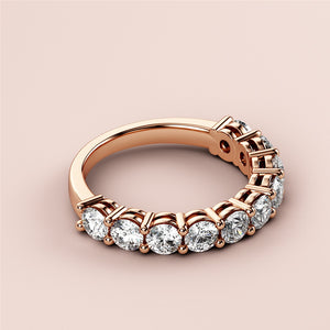 14K rose gold wedding band featuring a continuous row of oval-shaped diamonds in a modern basket setting. 