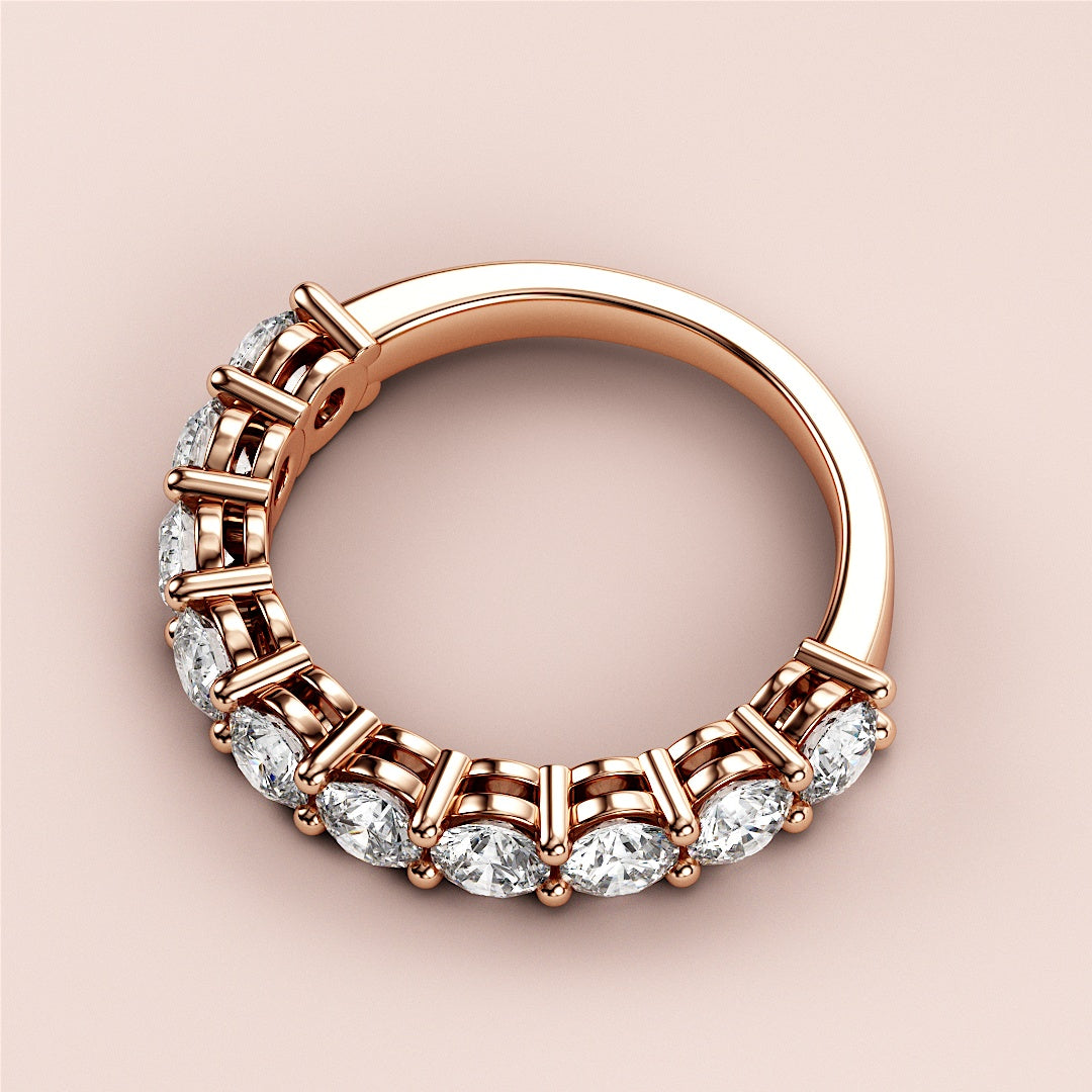 Elegant rose gold three-quarter eternity wedding band featuring brilliant round-cut diamonds, available in 14K, 18K, and platinum options. |
 
 
 
 
 #14KRecycledRoseGold
 #18KRecycledRoseGold