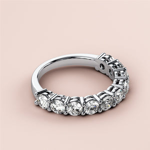 Elegant 14K or 18K white gold eternity wedding band, featuring round brilliant diamonds for a timeless, sophisticated look. 
