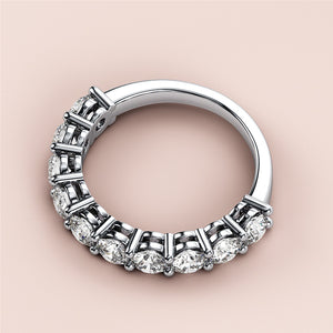 Elegant 14K or 18K white gold eternity wedding band with round-cut diamonds, perfect for everlasting love. 