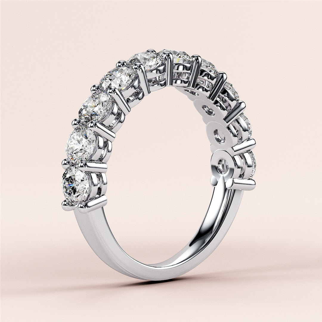 Elegant 14K or 18K gold or platinum three-quarter eternity wedding band with brilliant round-cut diamonds, showcasing timeless luxury. |
 #14KRecycledWhiteGold
 #18KRecycledWhiteGold
 
 
 
 
 #Platinum